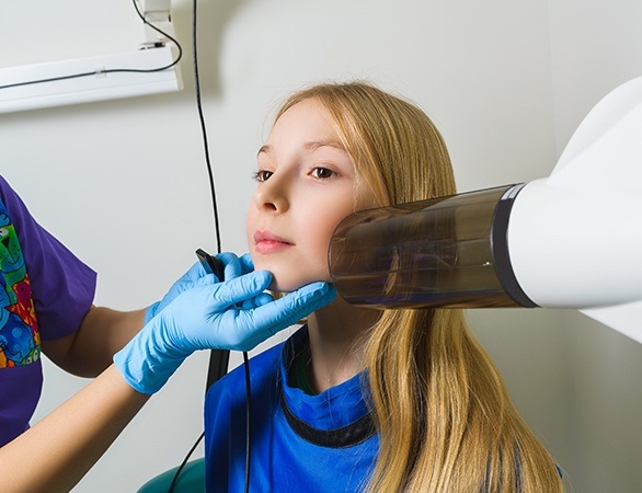 Young dental patient receiving bitewing x-rays