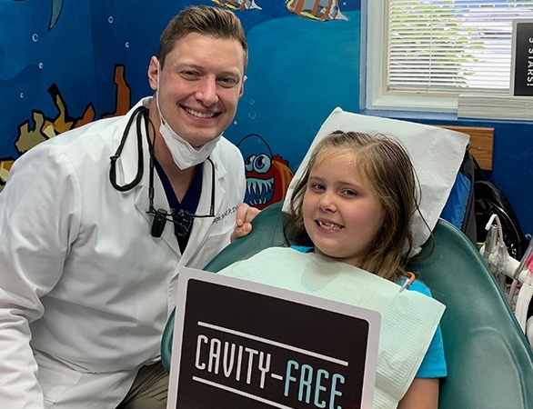 Little girl with Dr. Malecki at dental checkup