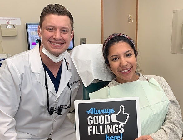 Dr. Malecki and preteen girl after tooth-colored filling placement