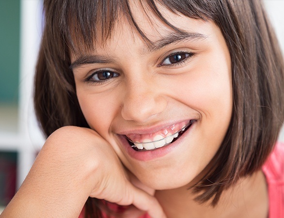 Young girl with orthodontic appliance in place