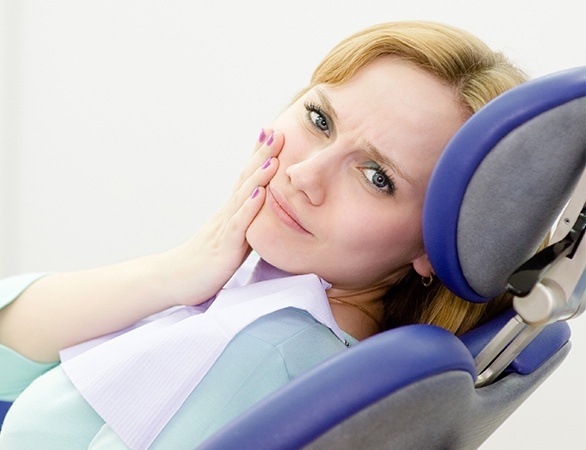 Woman at dental office for emergency dentistry appointment