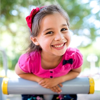 Littler girl laughing after children's dentistry appointment