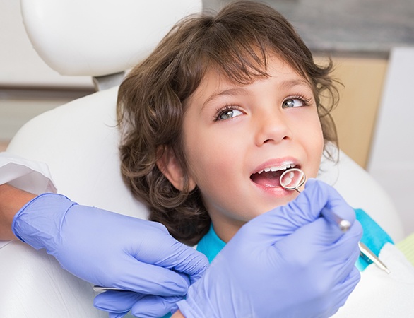 Child receiving dental fillings