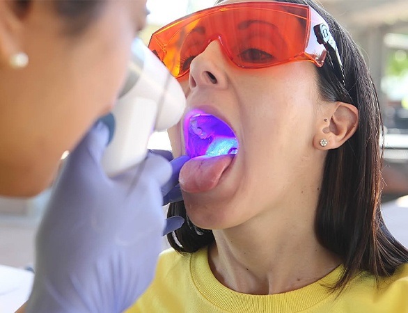 Patient receiving oral cancer screening