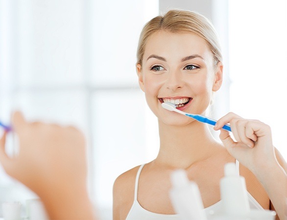 Woman brushing her teeth