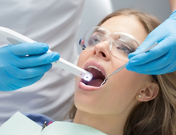 Dentist capturing intraoral images of a patient during dental exam